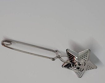 
                  
                    Stainless Steel Star Shaped Tea Infuser Approximately 6 1/4 inches long - Alchemy Botanicals & Herbs Corp
                  
                